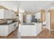 Bright kitchen with white cabinets, stainless appliances, and tile flooring at 6028 Dorset Rd, Spring Hill, FL 34608