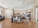 Spacious living room featuring wood floors, open layout and lots of natural light at 6028 Dorset Rd, Spring Hill, FL 34608