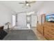 This main bedroom features vaulted ceilings, a ceiling fan, and wood look flooring at 6028 Dorset Rd, Spring Hill, FL 34608