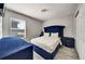 Bedroom with hard flooring, a crystal light fixture, and a luxurious, tufted bed set at 6222 Cherry Blossom Trl, Gibsonton, FL 33534