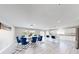 Open-concept dining area with modern furnishings, flowing into a kitchen with island seating at 6222 Cherry Blossom Trl, Gibsonton, FL 33534
