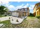 Charming two-story home featuring a well-manicured lawn and a two-car garage at 6222 Cherry Blossom Trl, Gibsonton, FL 33534