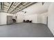 Large garage area with stainless steel refrigerator and stove, plus room for furniture and storage at 6222 Cherry Blossom Trl, Gibsonton, FL 33534