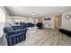 Spacious living room featuring modern decor, wood floors, and an open floor plan at 6222 Cherry Blossom Trl, Gibsonton, FL 33534