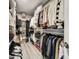 Spacious walk-in closet with custom shelving and ample storage for clothing and accessories at 6222 Cherry Blossom Trl, Gibsonton, FL 33534