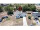 An aerial view of the lovely single-story home with a spacious yard, complemented by a long driveway at 6309 Covewood Dr, Spring Hill, FL 34609