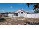 Well-kept backyard with a trampoline, white vinyl fencing, and a covered screened-in porch at 6309 Covewood Dr, Spring Hill, FL 34609