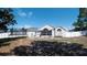 Large backyard featuring a trampoline, screen porch, and white vinyl privacy fence at 6309 Covewood Dr, Spring Hill, FL 34609
