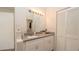 Bright bathroom features a modern vanity with stone countertop and plenty of storage space at 6309 Covewood Dr, Spring Hill, FL 34609