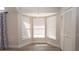 Bright bedroom features plenty of natural light with multiple windows and closet at 6309 Covewood Dr, Spring Hill, FL 34609