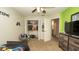 Comfortable bedroom with fan, carpet, closet, and a view into another room at 6309 Covewood Dr, Spring Hill, FL 34609