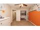Spacious bedroom with open closet, neutral carpet and view into hallway at 6309 Covewood Dr, Spring Hill, FL 34609
