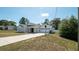 Well-maintained single-story home with a wide driveway, a two-car garage and manicured front lawn at 6309 Covewood Dr, Spring Hill, FL 34609