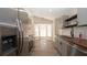 Modern kitchen featuring stainless steel appliances, wood countertops, and ample natural light at 6309 Covewood Dr, Spring Hill, FL 34609