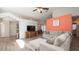 Open-concept living room with recessed lighting and contemporary furnishings, adjacent to the dining area at 6309 Covewood Dr, Spring Hill, FL 34609