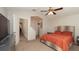 Spacious main bedroom features a large window, ceiling fan, and ample closet space at 6309 Covewood Dr, Spring Hill, FL 34609