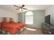 Relaxing main bedroom features a large window, ceiling fan, and ample space at 6309 Covewood Dr, Spring Hill, FL 34609