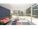 Screened patio area with cozy seating and view of the backyard at 6309 Covewood Dr, Spring Hill, FL 34609