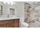 Beautifully renovated bathroom featuring neutral colors, new vanity and tiled shower at 6454 Summerfield Loop, Trinity, FL 34655