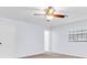 Bright bedroom with neutral paint, tan carpet and natural light from the large window at 6454 Summerfield Loop, Trinity, FL 34655