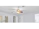 Bright bedroom featuring neutral paint, carpet and French doors at 6454 Summerfield Loop, Trinity, FL 34655