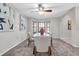 Bright dining room with a modern table set, stylish decor, and ample natural light at 6454 Summerfield Loop, Trinity, FL 34655