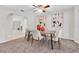 Elegant dining room with modern decor, a stylish table, and a cozy atmosphere at 6454 Summerfield Loop, Trinity, FL 34655