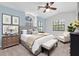 Stylish main bedroom featuring modern décor, neutral paint, and ample natural light at 6454 Summerfield Loop, Trinity, FL 34655