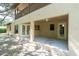 A covered outdoor patio with French doors opens to a spacious backyard, perfect for entertaining at 6454 Summerfield Loop, Trinity, FL 34655