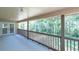 Outdoor patio with green views and French doors at 6454 Summerfield Loop, Trinity, FL 34655