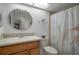 Bathroom with a vanity and a shower curtain at 7175 Bottle Brush Dr, Spring Hill, FL 34606