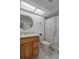 Bright bathroom with a tile floor and a shower at 7175 Bottle Brush Dr, Spring Hill, FL 34606