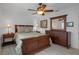 Bedroom featuring wood furniture and light laminate flooring at 7175 Bottle Brush Dr, Spring Hill, FL 34606