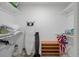 Walk in closet with shelving, a fan, and an ironing board at 7175 Bottle Brush Dr, Spring Hill, FL 34606