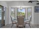 Light filled dining area overlooking the pool with views of the backyard at 7175 Bottle Brush Dr, Spring Hill, FL 34606