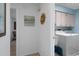 Open hallway with decor, leading to laundry room with a washer and dryer at 7175 Bottle Brush Dr, Spring Hill, FL 34606