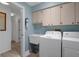 Laundry room featuring a utility sink and washer and dryer at 7175 Bottle Brush Dr, Spring Hill, FL 34606