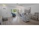 Inviting living room with a bay window and stylish seating, offering a bright and comfortable space at 7175 Bottle Brush Dr, Spring Hill, FL 34606