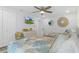 Coastal bedroom featuring two beds, a TV, and beachy decor at 7422 New York Ave, Hudson, FL 34667