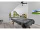 A pool table with a cover is featured in a recreation room with light grey floors at 7422 New York Ave, Hudson, FL 34667