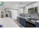 Well-equipped kitchen with custom backsplash, stainless appliances and an undermount sink at 7422 New York Ave, Hudson, FL 34667