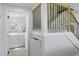 Convenient laundry room with modern appliances near staircase at 7422 New York Ave, Hudson, FL 34667