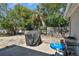 Outdoor backyard with a grill, kiddie pool, and ample space, perfect for entertainment and relaxation at 7535 Christina Ln, Port Richey, FL 34668