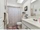 Bathroom featuring a shower-tub combo, vanity and modern sink at 7535 Christina Ln, Port Richey, FL 34668