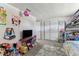 Cozy bedroom designed with playful decor, a bunk bed, and built-in storage solutions at 7535 Christina Ln, Port Richey, FL 34668