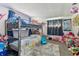 Bright bedroom with a bunk bed, plush rug, and ample space for activities at 7535 Christina Ln, Port Richey, FL 34668
