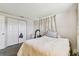 This bedroom features neutral walls, carpet flooring, and a wardrobe at 7535 Christina Ln, Port Richey, FL 34668