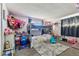 Cheerful bedroom featuring a bunk bed and playful decor at 7535 Christina Ln, Port Richey, FL 34668