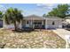 Charming single-story home featuring a covered porch, a well-maintained lawn, and a cozy curb appeal at 7535 Christina Ln, Port Richey, FL 34668