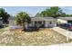 The property has a cozy single-story home enhanced by a covered front porch for a warm, welcoming entry at 7535 Christina Ln, Port Richey, FL 34668